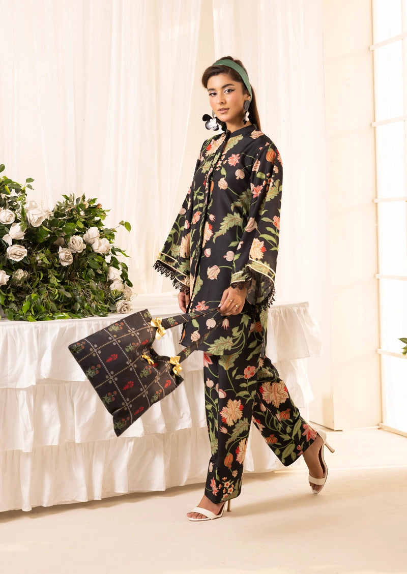 Woman in a floral outfit standing in a well-lit room with white curtains and a table with flowers.