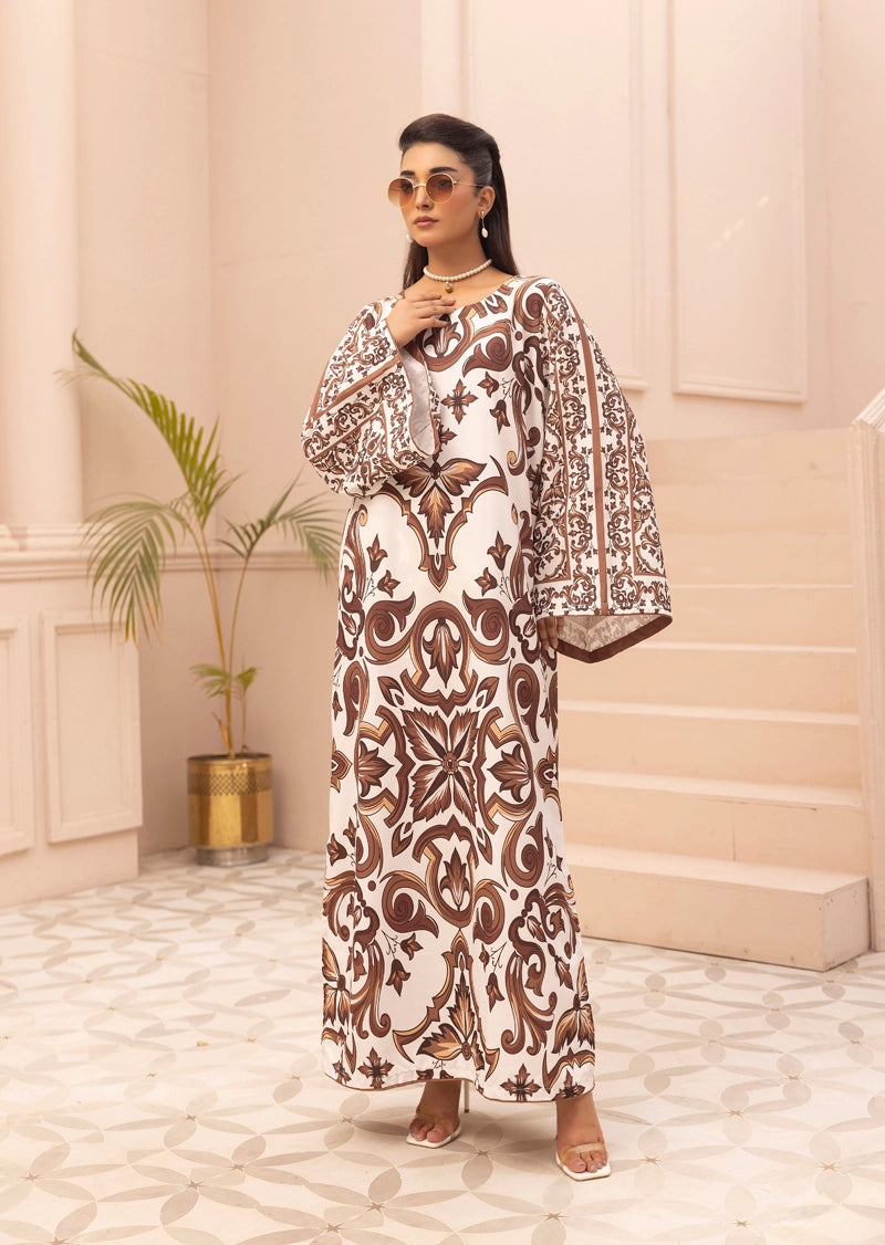 Woman wearing a patterned dress in an elegant interior setting