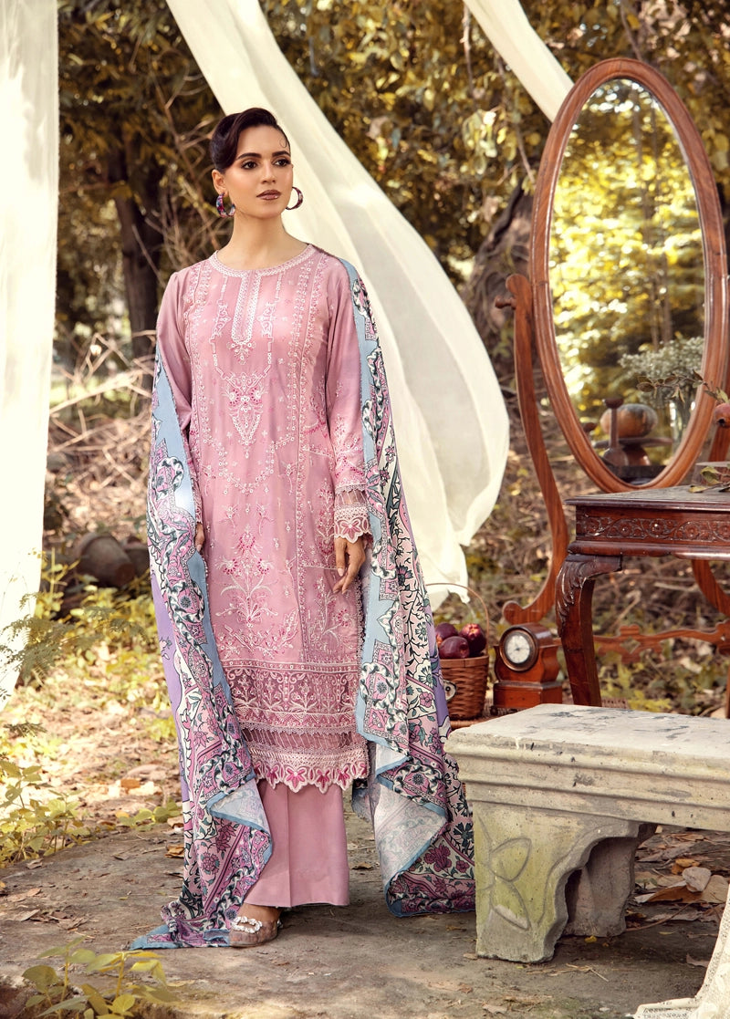 Woman in a pink traditional outfit with a floral dupatta standing outdoors near a mirror.