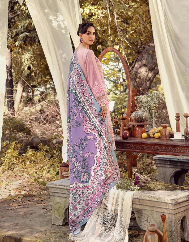 Woman in a traditional outfit standing in a garden setting with a table and decorative items.