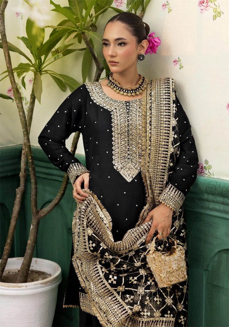 Woman in a black and gold traditional outfit with floral background