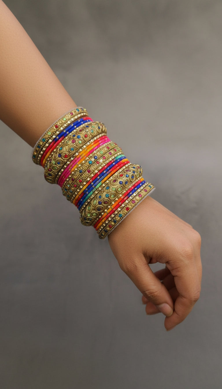 Colorful bangles with gold accents on a gray surface