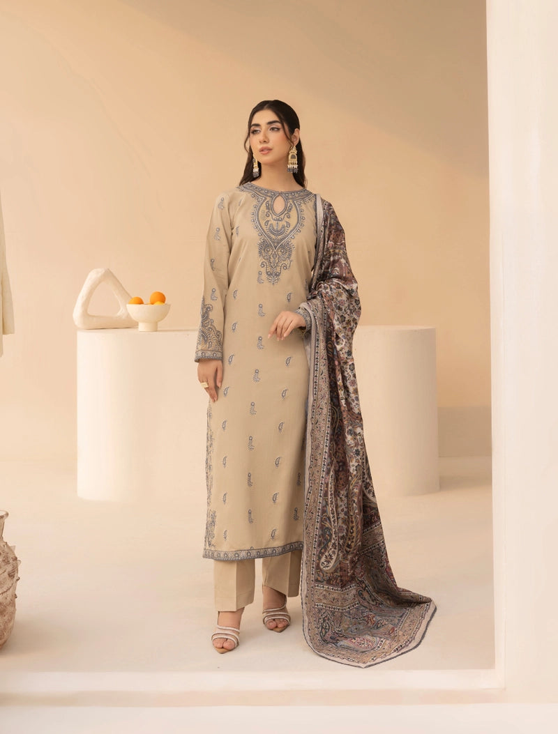 Woman wearing a traditional outfit with embroidery in a minimalistic setting