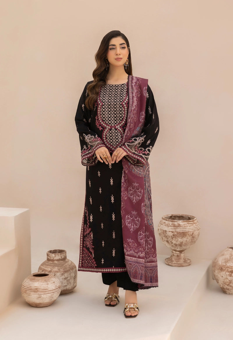 Woman wearing a black and purple embroidered outfit with decorative vases in the background