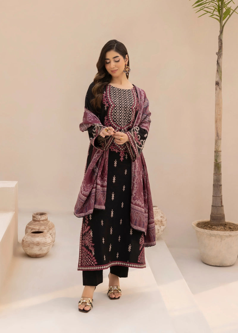 Woman wearing a black and purple traditional outfit with a plant in the background